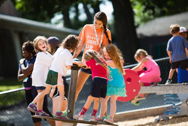 a group of kids playing on a playground