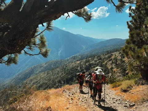 a group of hikers hiking up a mountain