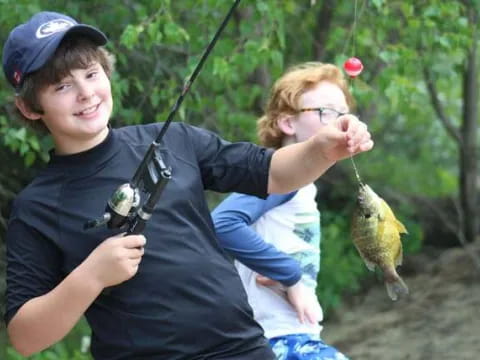 a person holding a baby and a bird