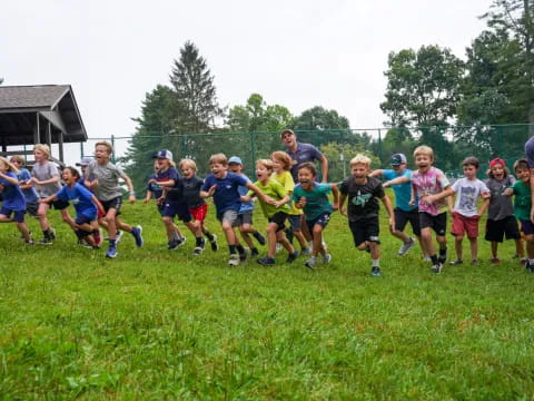 a group of people running on a field