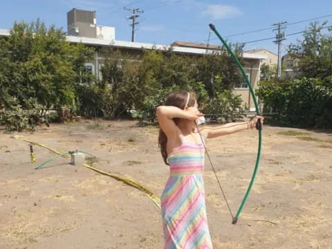 a person in a swimsuit holding a hose