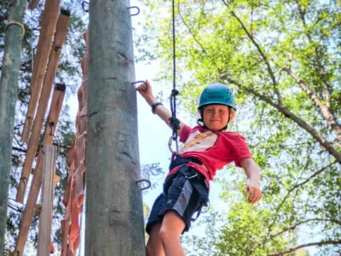 a young boy on a zip line