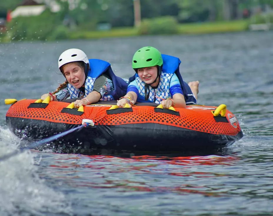 a couple of kids in a raft