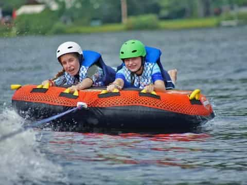 a couple of kids in a raft