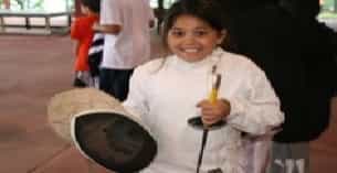a boy holding a drum