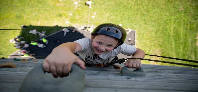 a child in a helmet on a boat