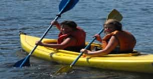 a couple of people in a canoe