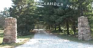 a dirt road with trees on either side of it