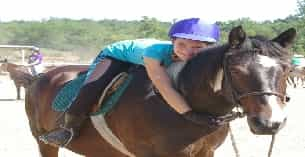 a girl riding a horse