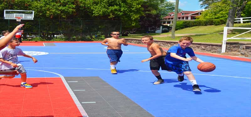 a group of boys playing basketball