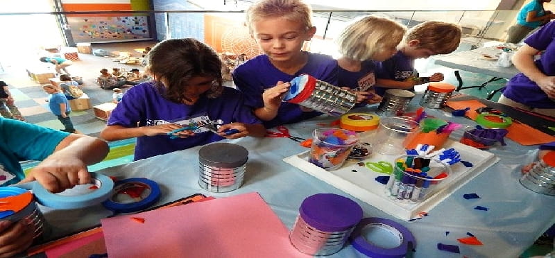 a group of children painting