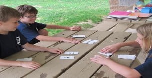 a group of children playing a board game