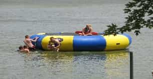 a group of people in a floating tube in the water