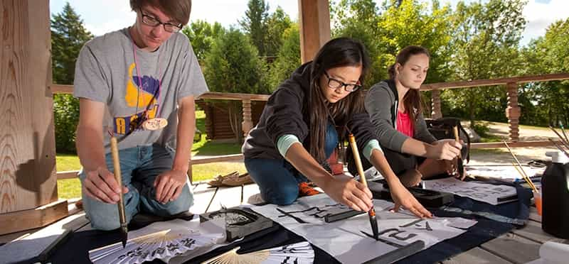 a group of people painting