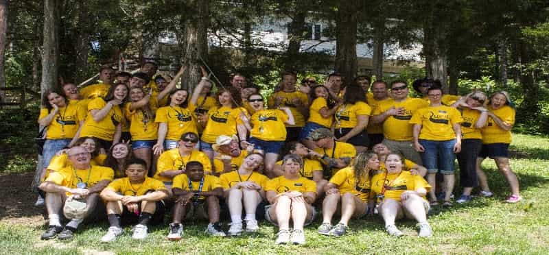 a group of people wearing yellow shirts
