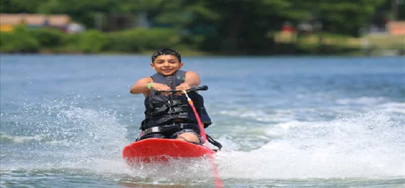 a man riding a water ski