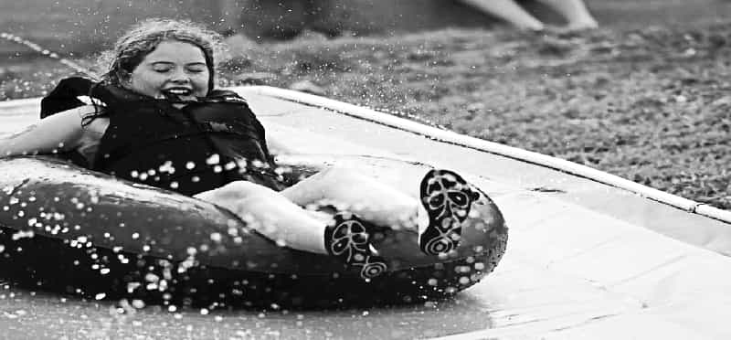 a person lying on a surfboard