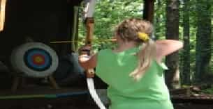 a person shooting a bow and arrow