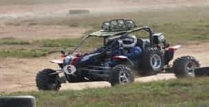 a race car on a dirt track