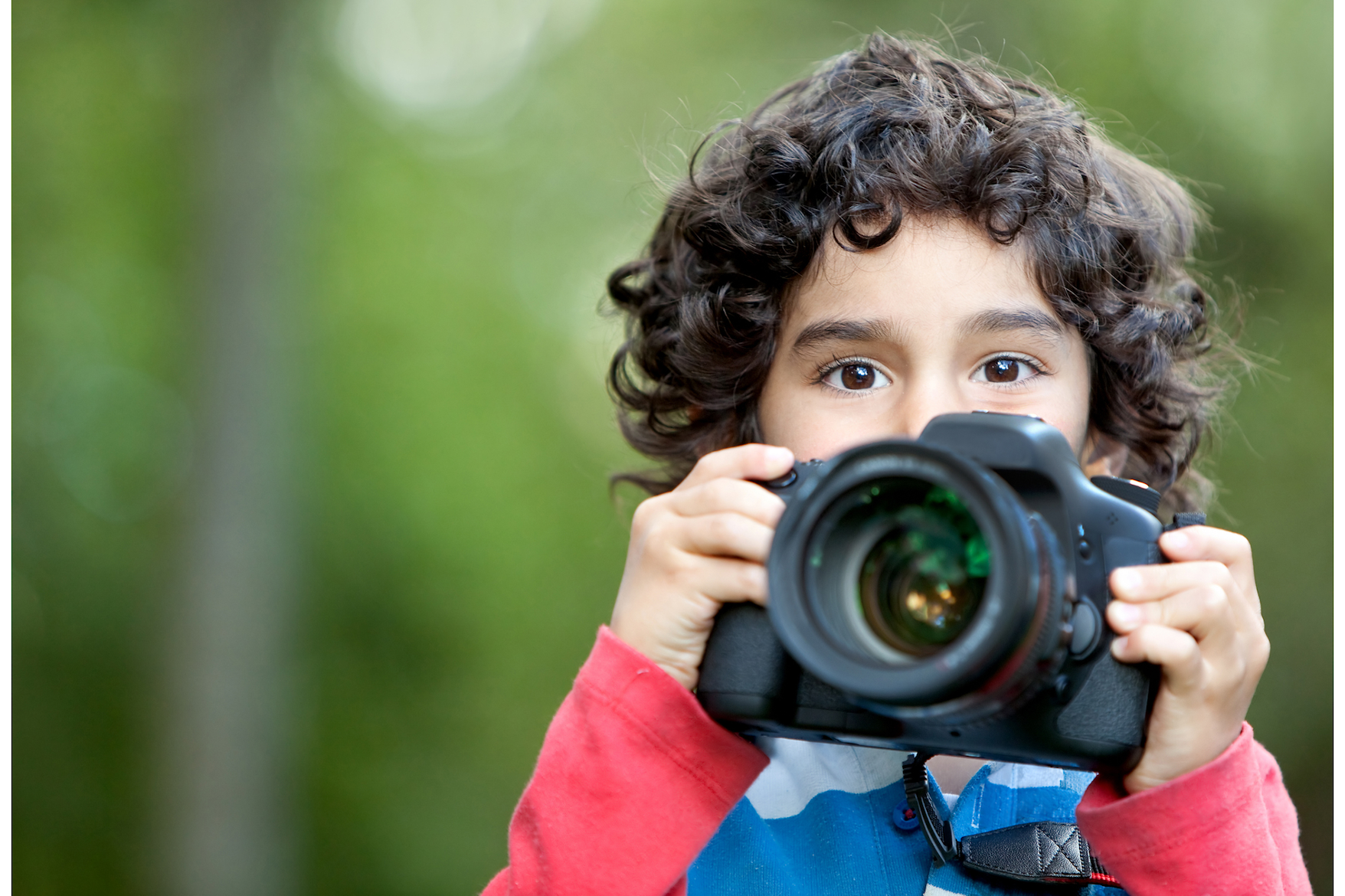 a child holding a camera