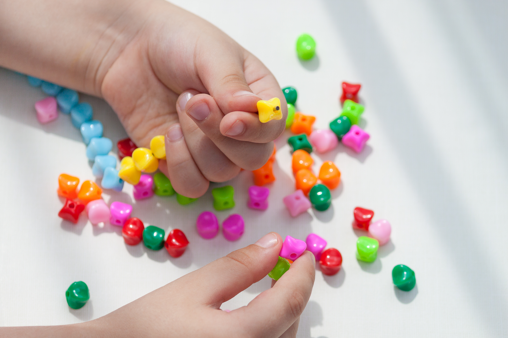 a person's hands with colorful candies on them