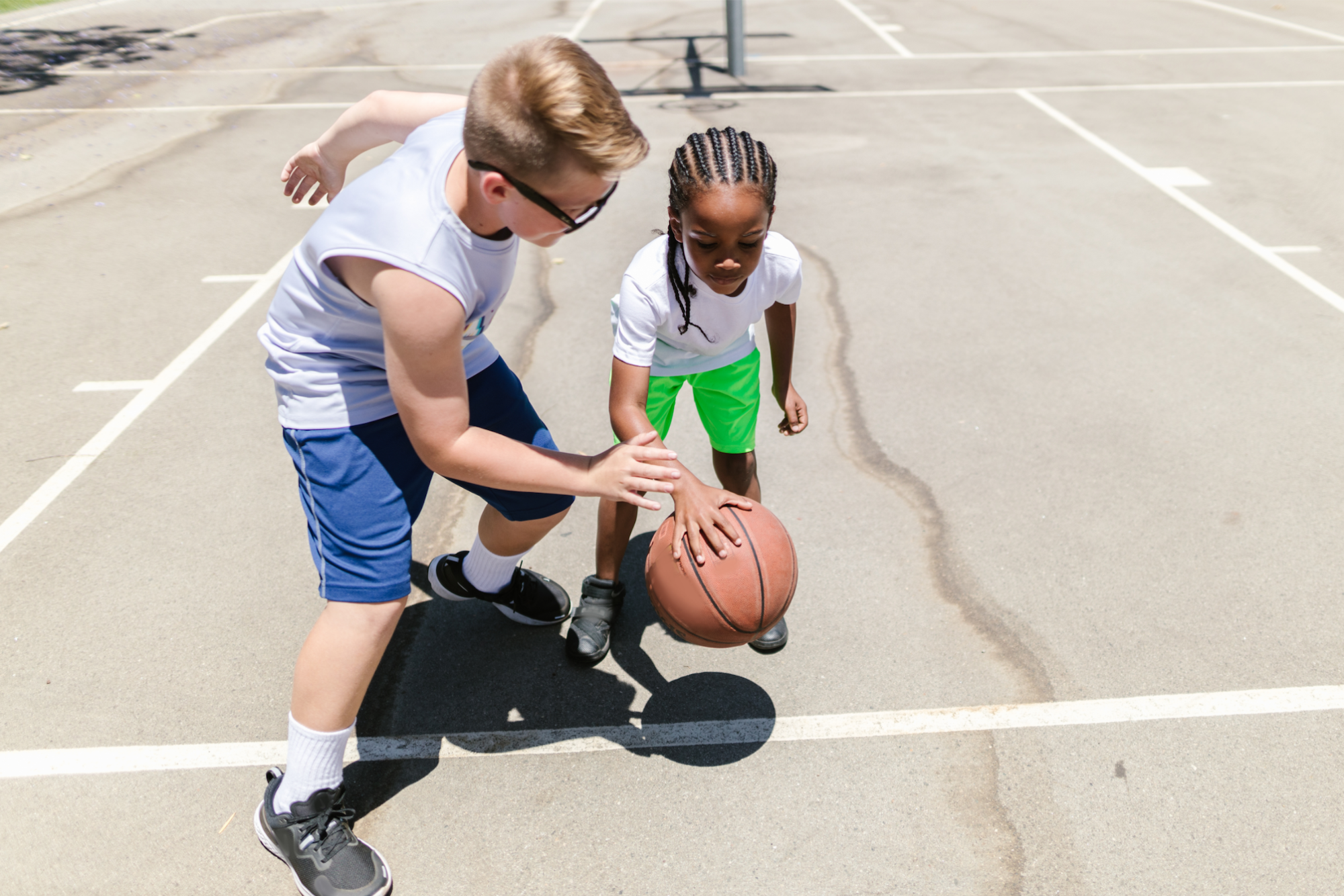 a person and a girl playing basketball