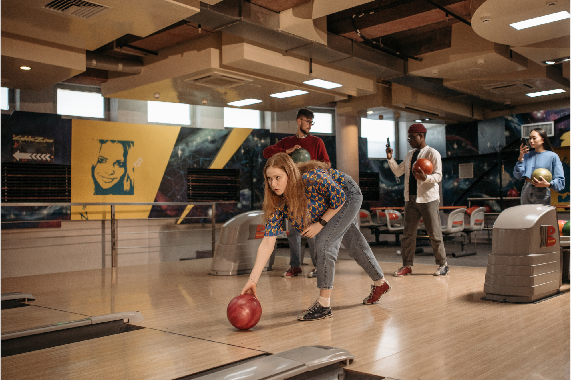 a person bowling in a bowling alley