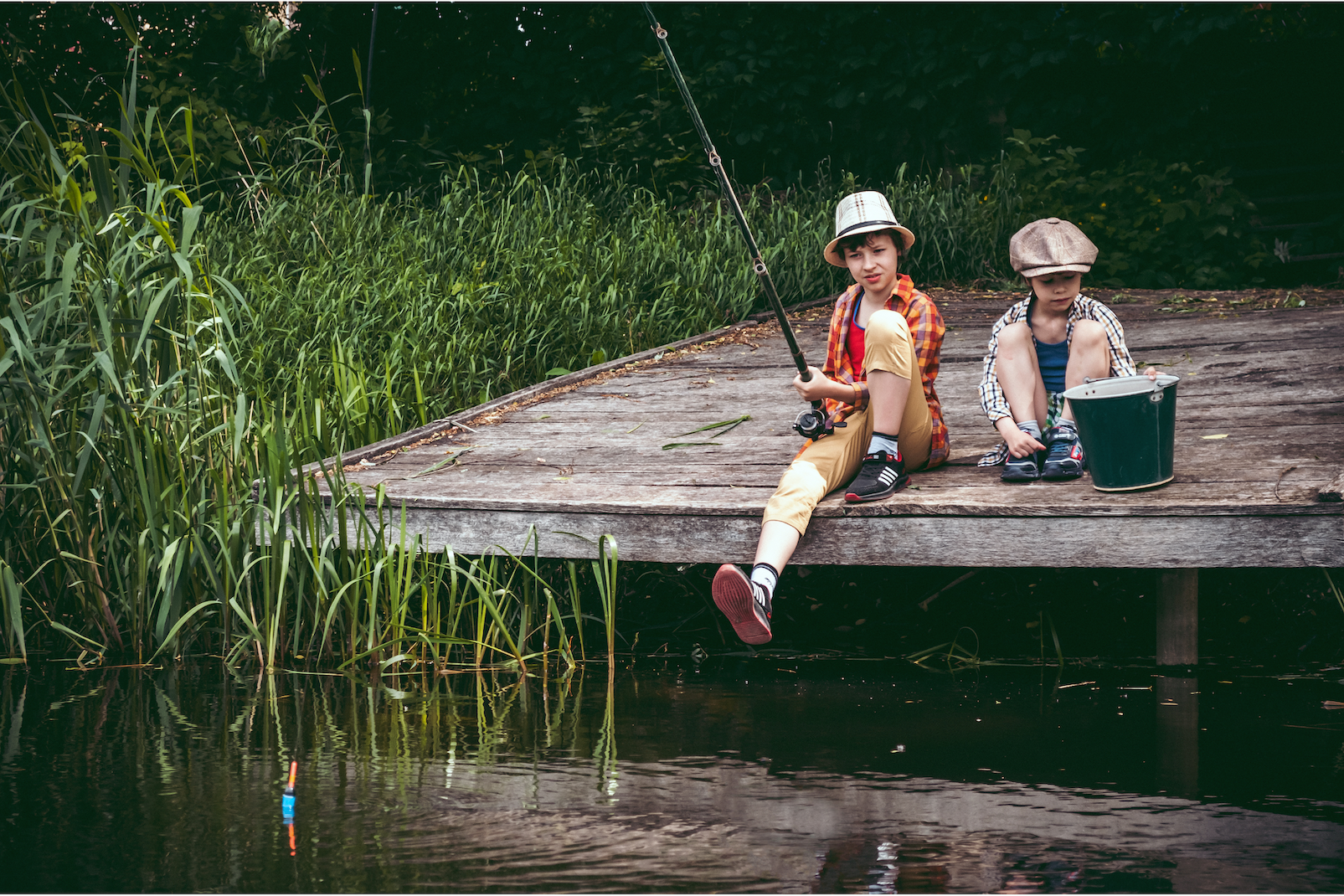 a couple of kids fishing