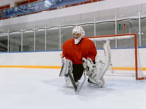 a man playing hockey