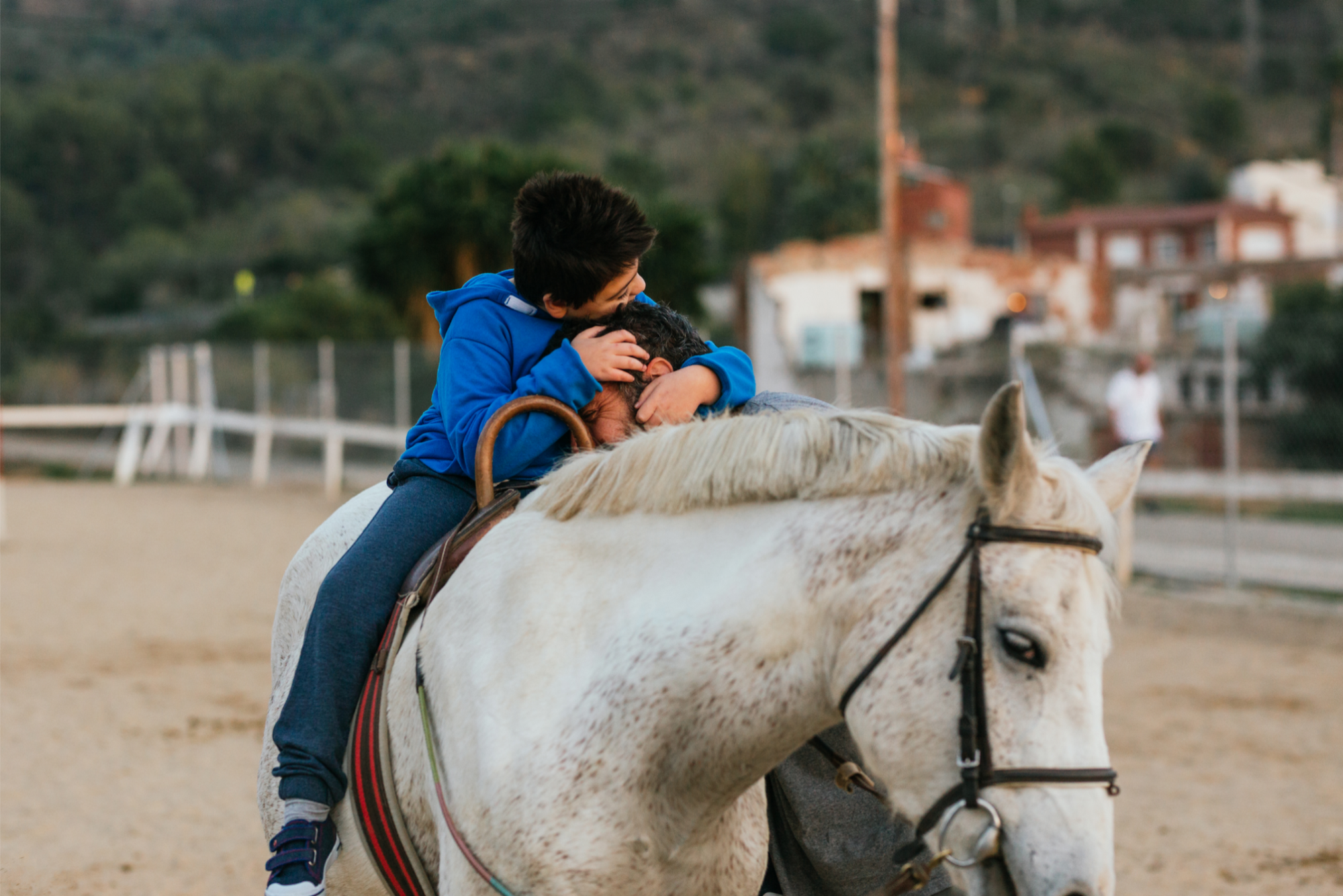 a boy riding a horse
