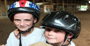 two people wearing helmets