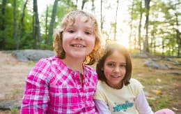 a couple of girls smiling