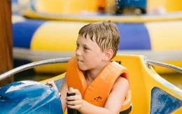 a boy in a yellow shirt