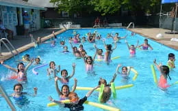 a group of people in a pool