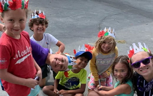 a group of children wearing party hats