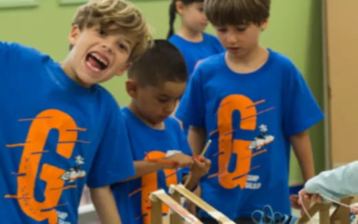 a group of boys in blue shirts