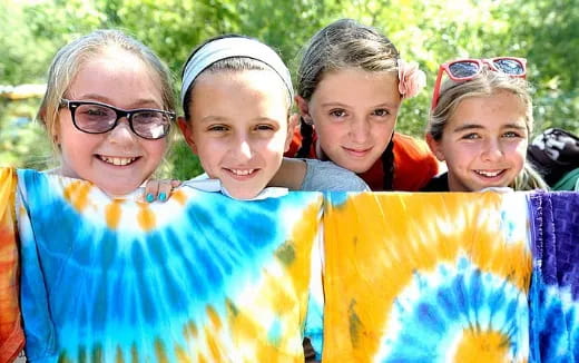 a group of girls wearing colorful clothing