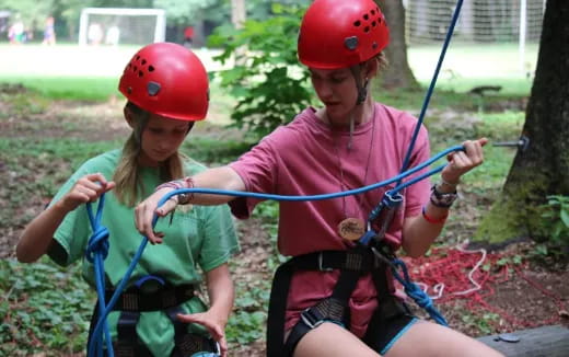 a person and a girl wearing helmets