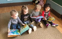 a group of children sitting on the floor