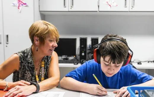 a woman and a man wearing headphones