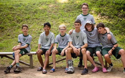 a group of people sitting on a bench