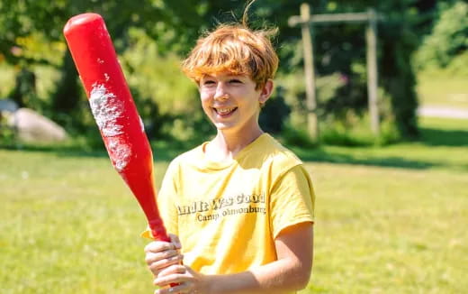 a boy holding a bat