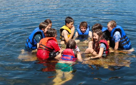 a group of children in the water