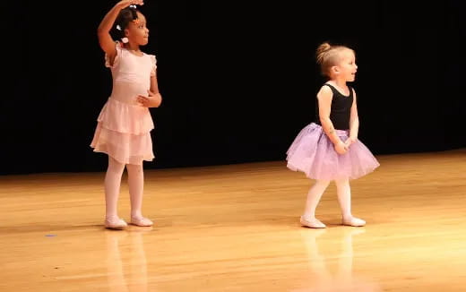 two girls on a stage