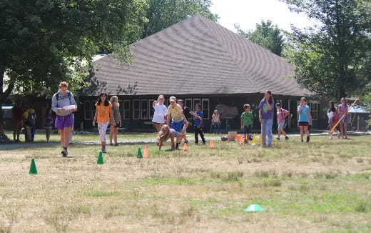 a group of people playing frisbee