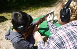 a person holding a gun to a child's head