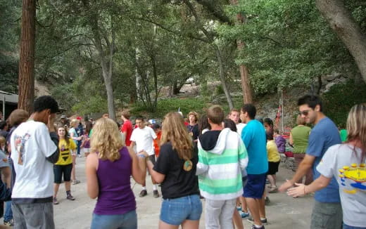 a group of people walking in a park