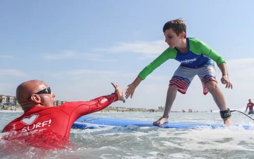 a person and a child playing in the water