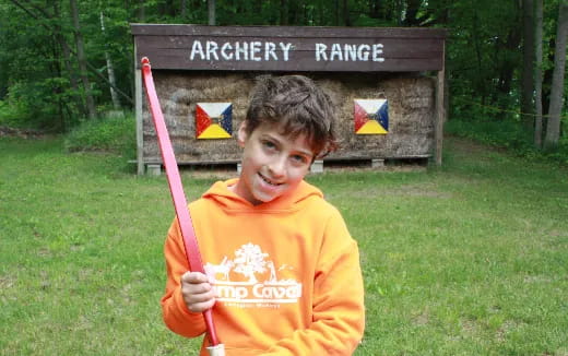 a boy holding a baseball bat