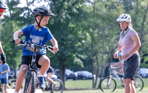 a group of people riding bikes